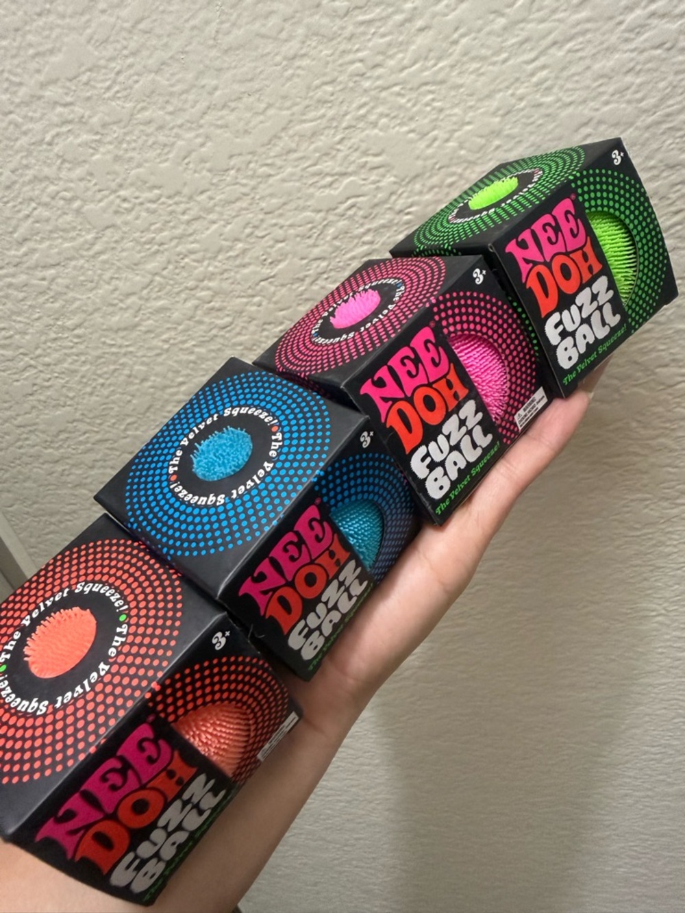 Bundle of 4 Needoh. Fuzzy ball in orange, blue, pink & green. NEW. Viral squishy